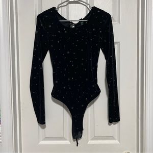 Black velour long sleeve bodysuit with moon and stars